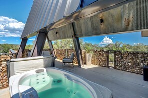 Soak in the hot tub while taking in breathtaking views—pure relaxation awaits!