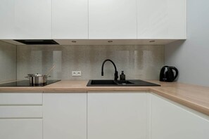 Kitchenette with a dishwasher.