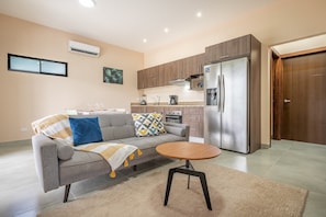 Living room, dining, and kitchen spaces