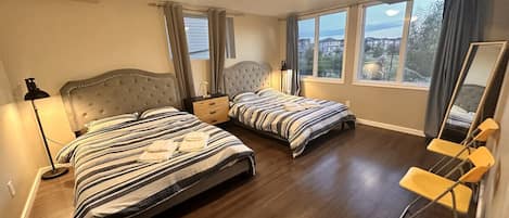 Massive bedroom with 2 Queen Beds and a beautiful pond view