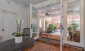 The first-floor floyer/entrance looks right into the beautiful back yard veranda