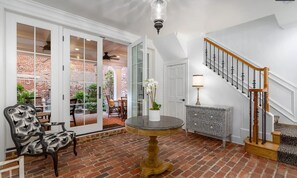 This is the foyer entrance with steps up to the main floor kitchen & living room