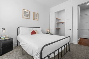The bedroom offers a luxurious retreat, with a bed that promises restful nights and a room that feels like a private oasis.