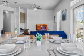 The dining room is bathed in natural light, creating a bright and inviting space where every meal feels special.