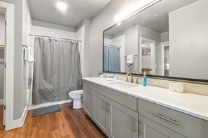 As you step into the bathroom, the clean lines and soothing colors create a space where you can relax and refresh.