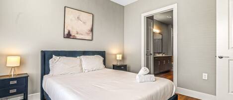 As you enter the bedroom, the sophisticated decor and plush bedding create a space where you can truly unwind.