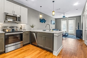 As you step into the kitchen, the clean lines and functional design make you eager to start cooking your favorite dishes.
