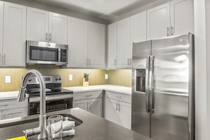 As you step into the kitchen, the clean lines and functional design make you eager to start cooking your favorite dishes.