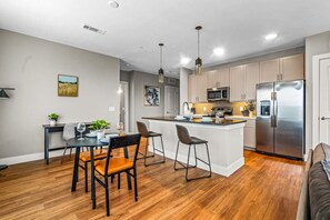 You are surrounded by tasteful decor and warm tones, making the dining room a perfect setting for any occasion.