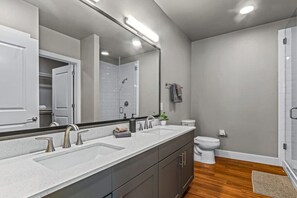 You feel a sense of calm as you enter the bathroom, where the thoughtful design and high-quality materials create a serene environment.