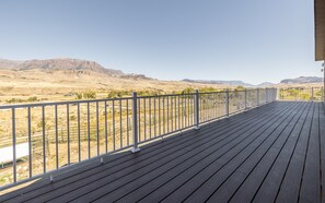 Expansive deck offering amazing panoramic views of the surrounding mountains, perfect for enjoying your morning coffee or evening sunsets.