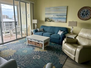 Family room and large balcony that runs the length of condo