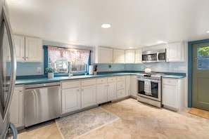 The kitchen is the perfect space for preparing a home cooked meal.