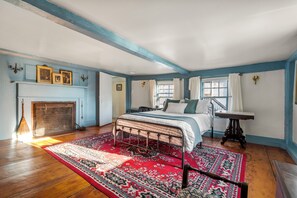 This second floor bedroom has lot's of character with it's historic touches.