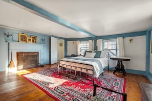 This second floor bedroom has lot's of character with it's historic touches.