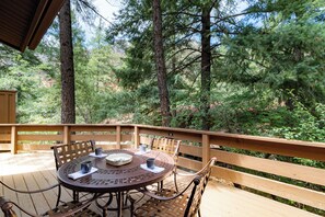 Patio in the trees with outdoor seating