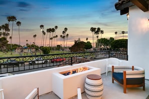 Unwind in your own private balcony on the second level of this home with firepit and patio furniture