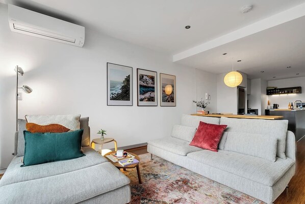Get comfortable in the living area. There’s a plush sofa, chaise and TV for movie nights at home. Split-system heating and cooling keep temperatures comfortable.

