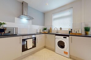 A glimpse into a modern kitchen, showcasing a sleek white sink and counter that enhance the overall aesthetic. This design not only elevates functionality but also inspires a love for cooking. #ModernLiving #KitchenStyle #DesignInspo 🥗🏠