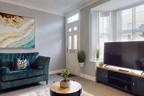 Step into a sanctuary of comfort with this beautifully arranged living room. The plush couch, chic coffee table, and sleek television set the stage for memorable moments with family and friends. ✨ #CozyVibes #HomeDecor #LivingRoomInspo