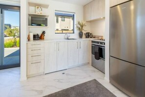 Open plan kitchen with Fridge/freezer and oven
