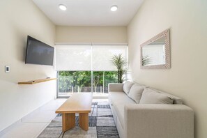 Bright and welcoming living area, featuring modern decor and ample natural light