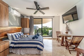 Relax in this cozy bedroom with plush bedding and serene decor