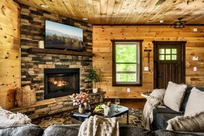 Cozy living area with an indoor fireplace