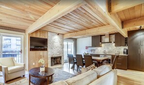 The living room features a sleeper sofa