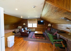 Living room with twin bed in corner