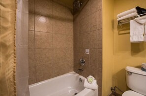 Clean and inviting bathtub area, ready for a relaxing soak.