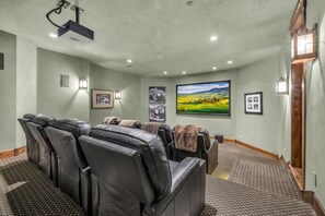 Game room with lounge chairs and a projector, Luxury Park City vacation rentals.