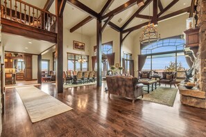 Grand living area in Morning Star with fireplace, chandeliers.