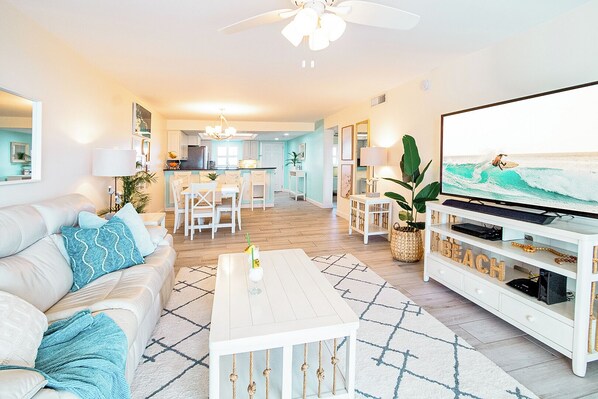 Bright and spacious living area with coastal-inspired decor and elegant furnishings.