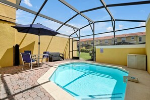 Relax in our inviting resort-style pool surrounded by lush palm trees, with plenty of seating and shade