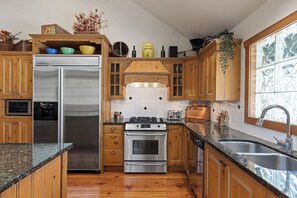 Cook up a feast in this well-equipped kitchen, featuring sleek stainless steel appliances