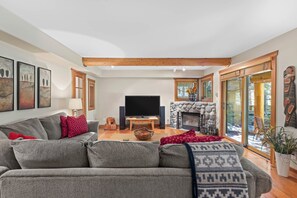 Relax in comfort while enjoying endless entertainment options in this inviting media space