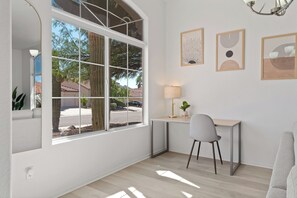 Workspace 1: Located on the 1st floor with views of the front yard