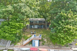 Nestled among lush trees in Honeoye’s Willow Beach, this cozy lakeside home offers privacy and direct water access for your ideal getaway. 