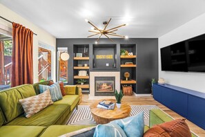 Living room with massive 65" smart TV - seating for everyone!