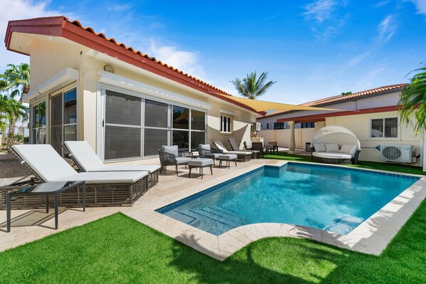 - Relax by the sparkling pool in this private backyard oasis - Lounge in the comfortable outdoor seating areas, ideal for soaking up the sun or relaxing in the shade - Enjoy the privacy and tranquility of this beautifully landscaped backyard