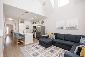 Inviting family hub with seamlessly integrated kitchen, dining, and living areas, perfect for creating lasting memories