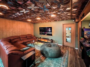 Our game room features billiards, an arcade, and big screen TV. 