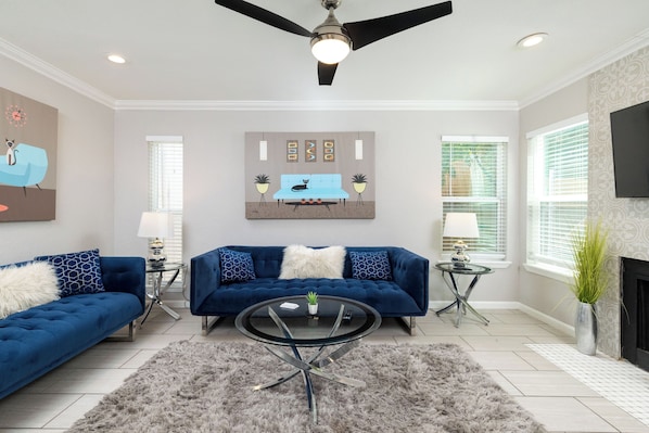 Spacious living room with fireplace and smart tv