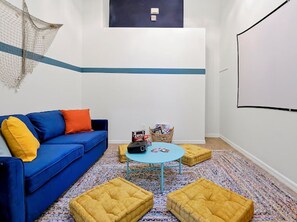 Game room / movie theater / and bedroom all in one room