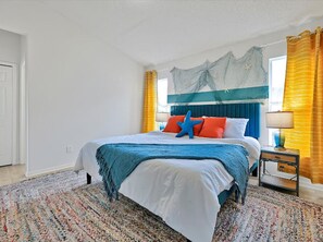 Under-the-sea themed bedroom with king bed