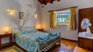The bedroom offers a double bed with a wardrobe and pool view
#bedroom #bed #view #algarve #portugal