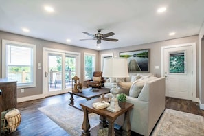 
Cozy living room, featuring plenty of comfortable seating, a ceiling fan, and a smart TV for your entertainment. Step out onto the balcony for breathtaking views of Fort Loudon Lake, the perfect spot to relax and take in the serene surroundings.