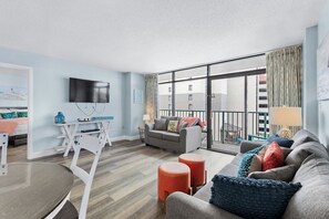 Sunlit Living Space with Ocean View Balcony Access
