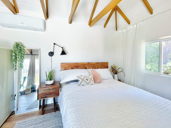 Queen bed comfortably accommodates 2 people with memory foam mattress & pillows